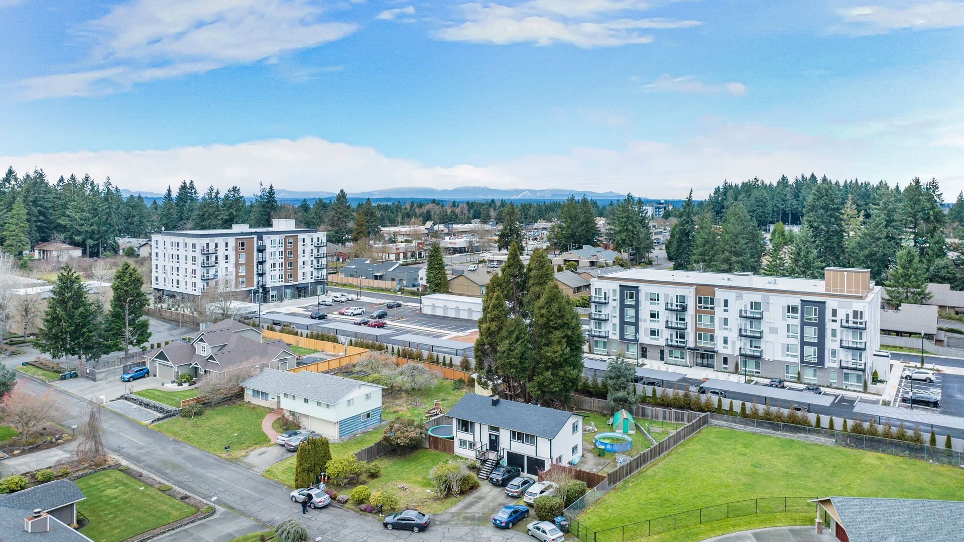 An aerial view of a city with a lot of buildings and trees.