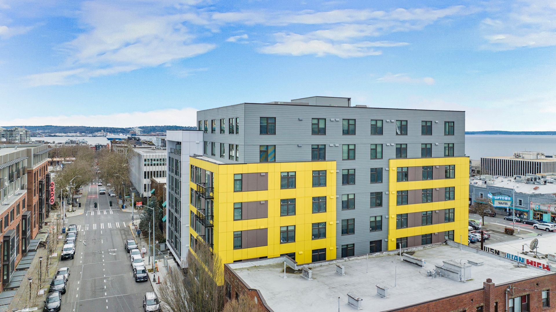 An aerial view of a large building in the middle of a city.