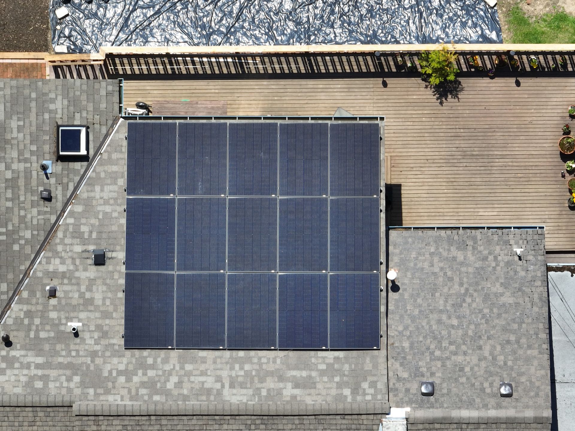 An aerial view of a roof with solar panels on it