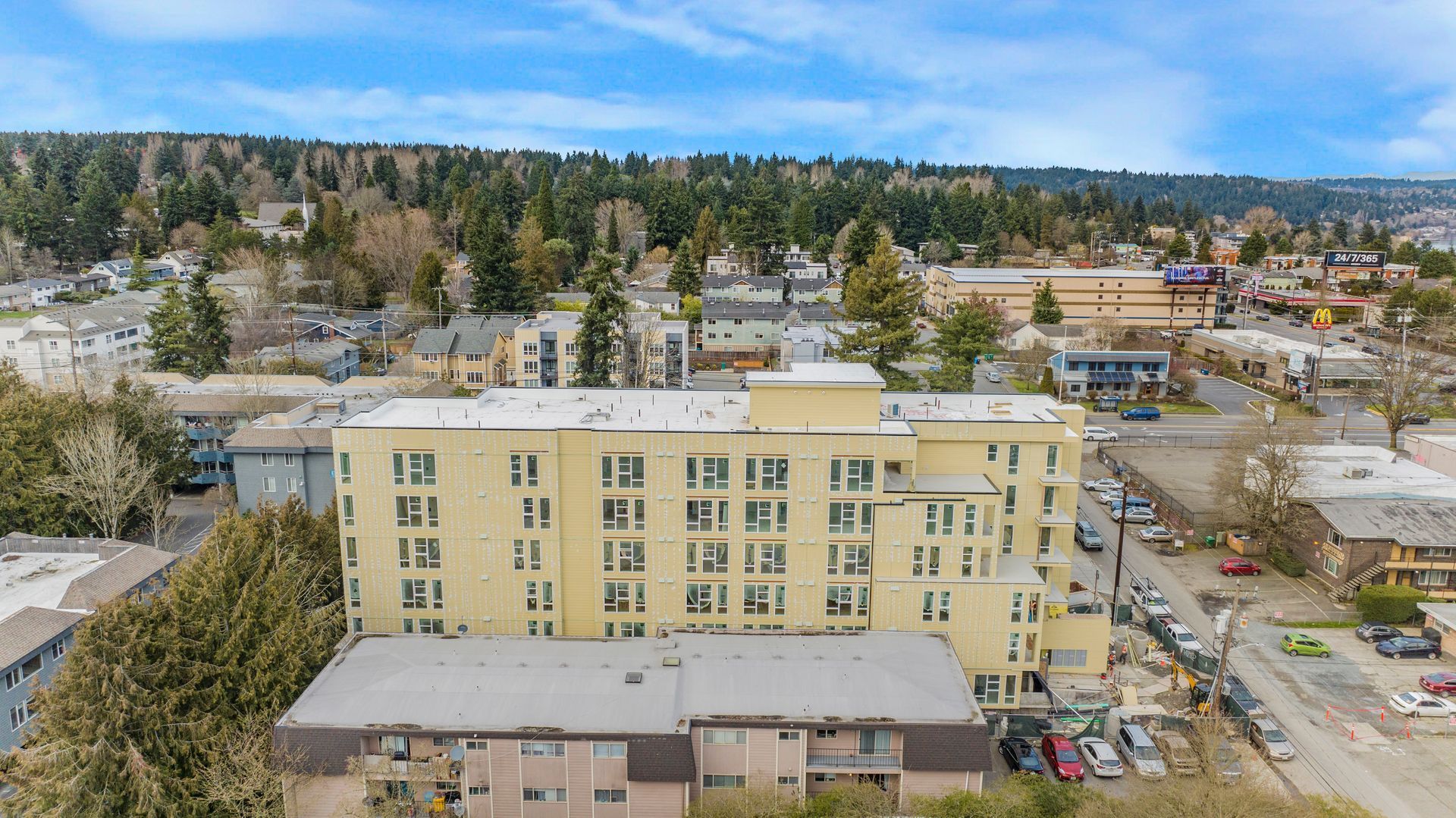 An aerial view of a large building in the middle of a city.