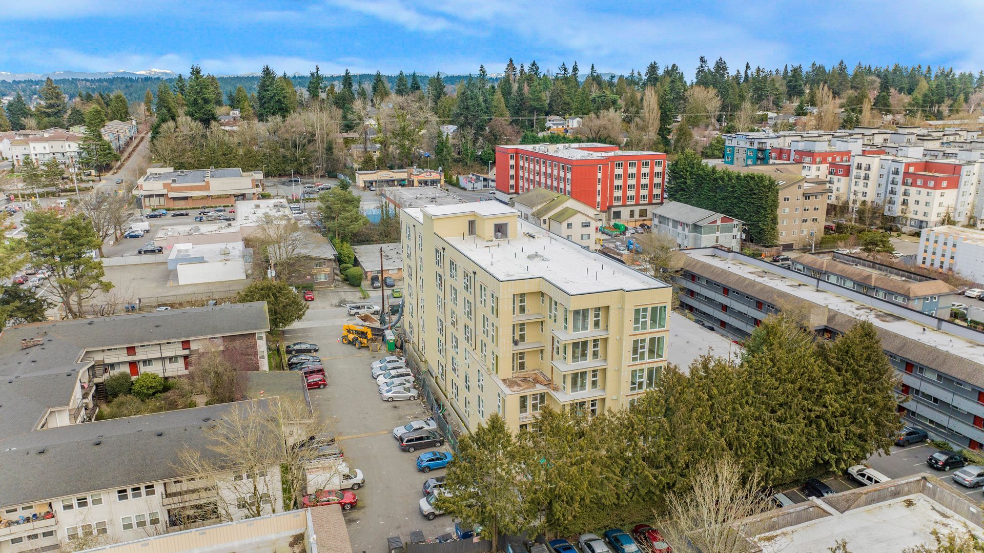 An aerial view of a city with a lot of buildings and trees.