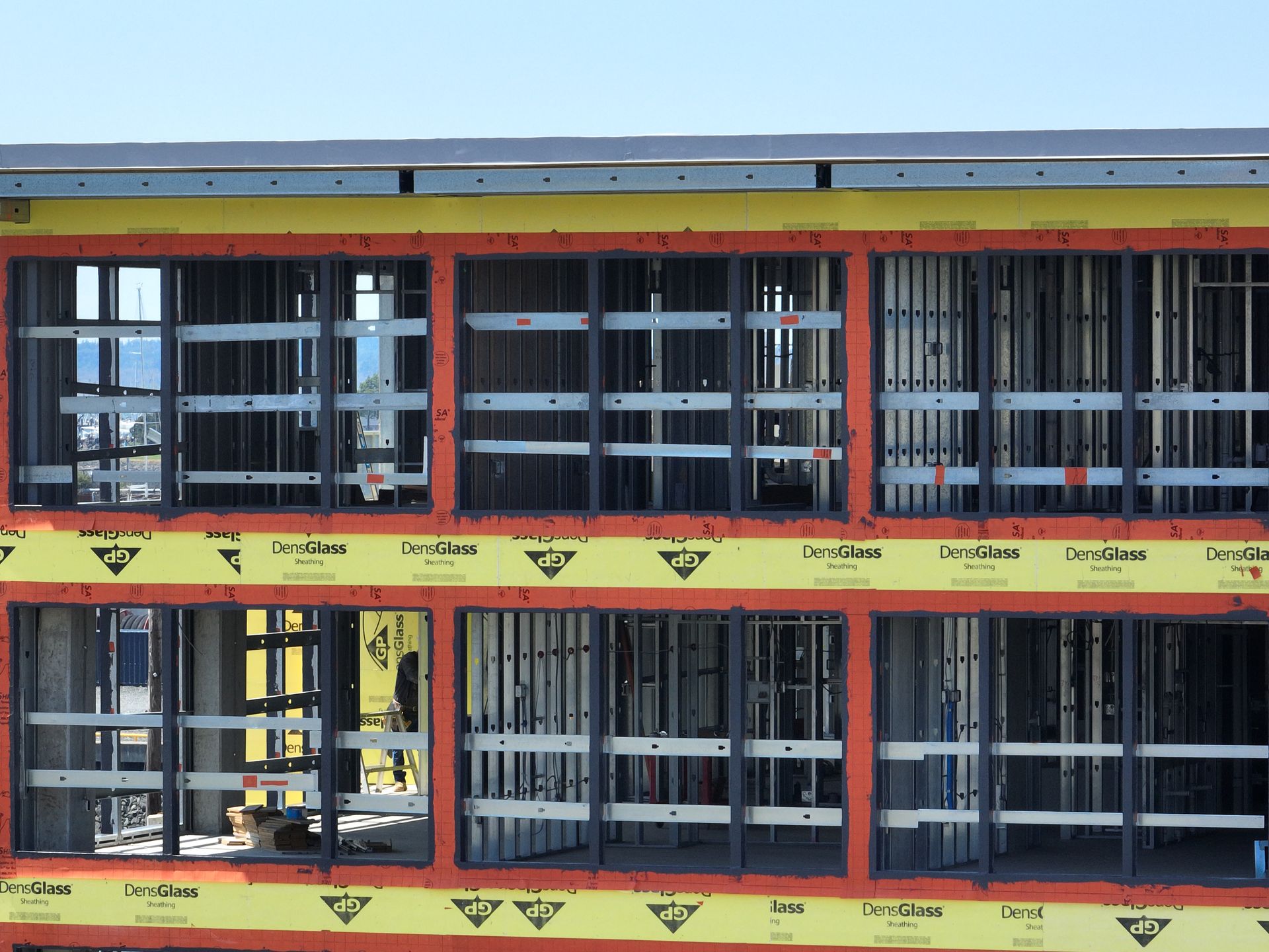 A building under construction with a lot of windows
