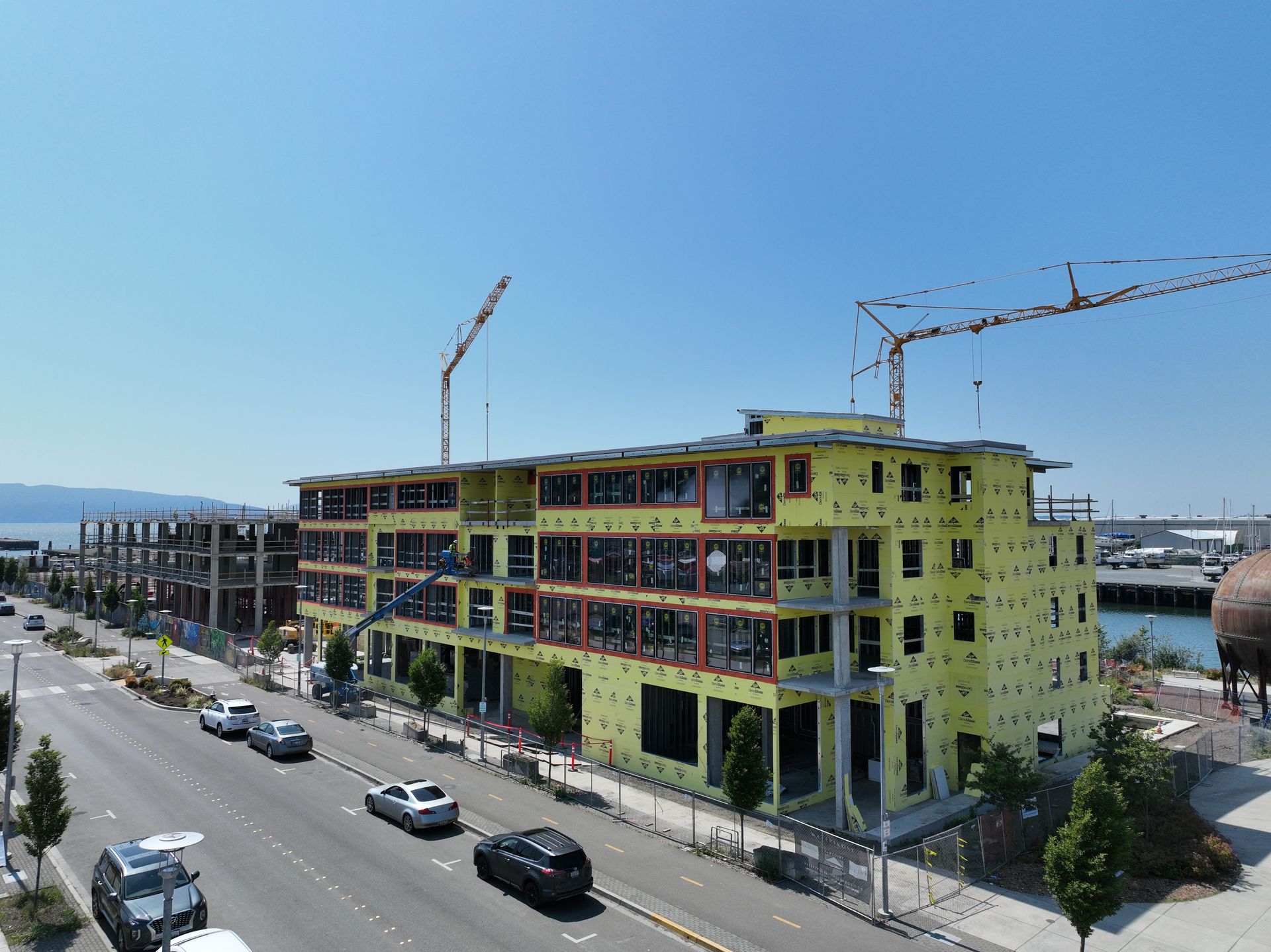 An aerial view of a building under construction on a city street