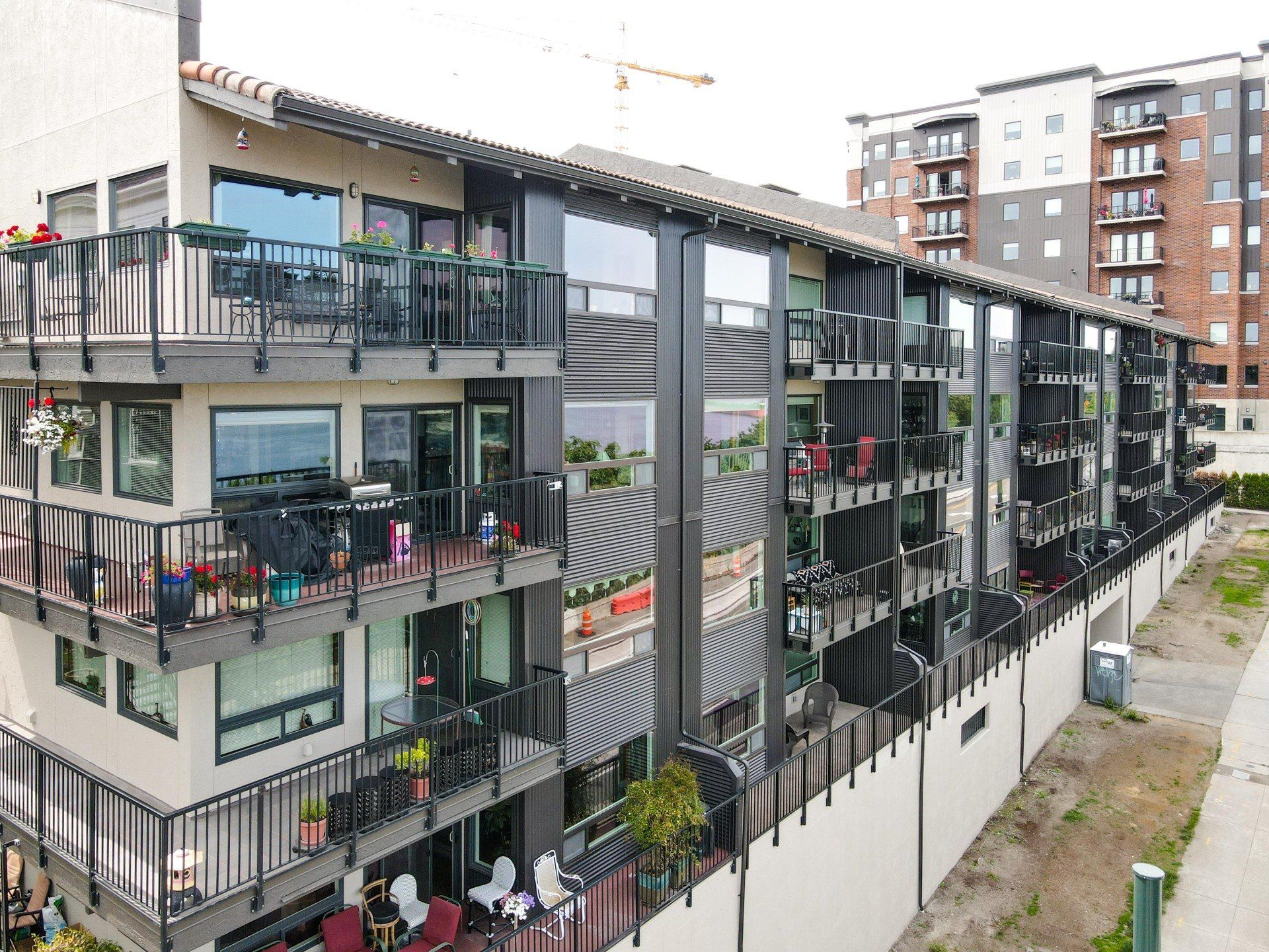 An aerial view of a large apartment building with balconies.