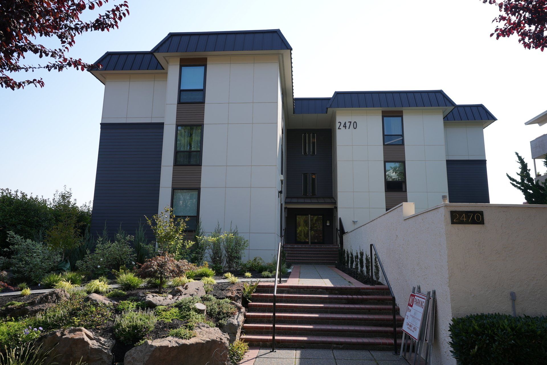 A large white building with stairs leading up to it
