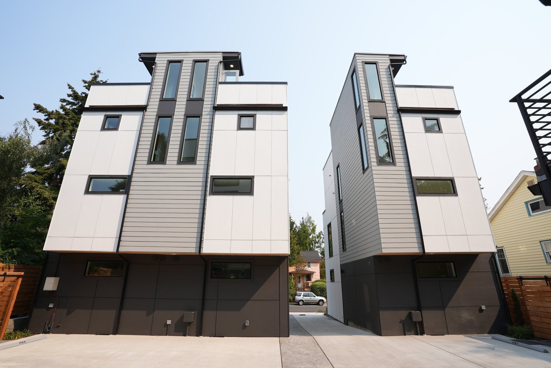 Two buildings with a lot of windows are next to each other