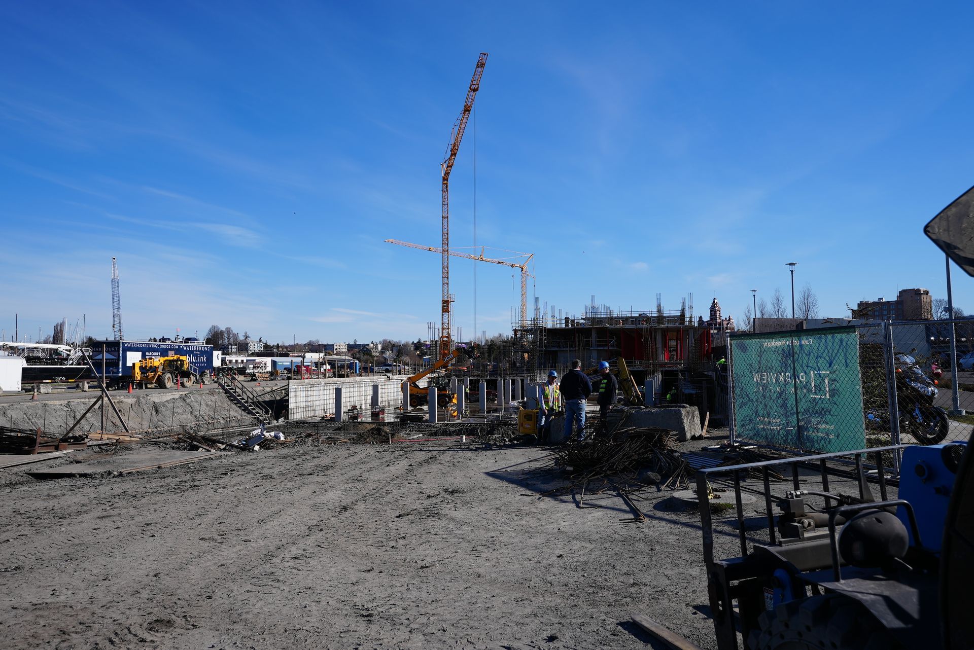 A construction site with a crane and a sign that says ' a ' on it.
