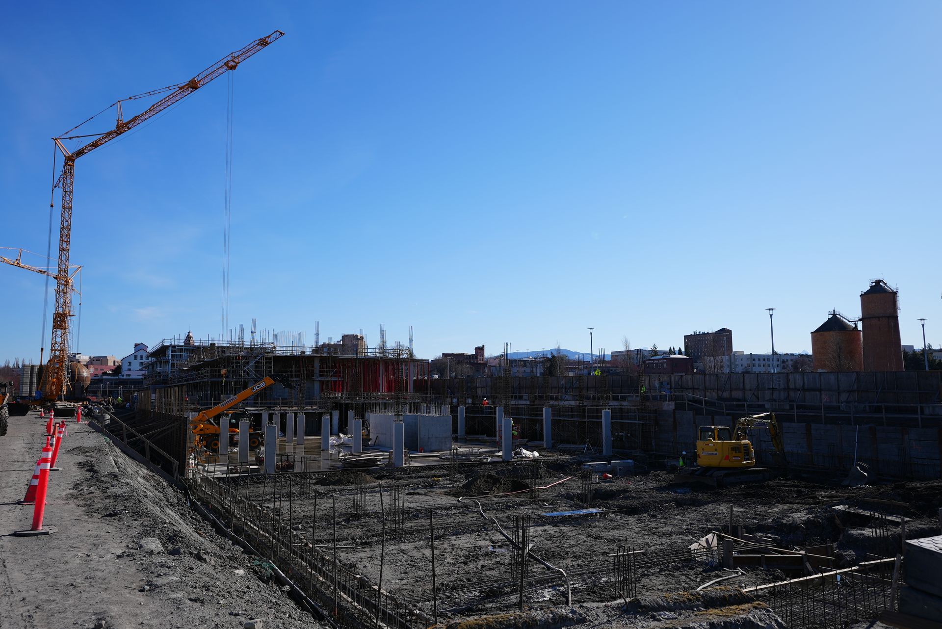 A construction site with a crane in the foreground