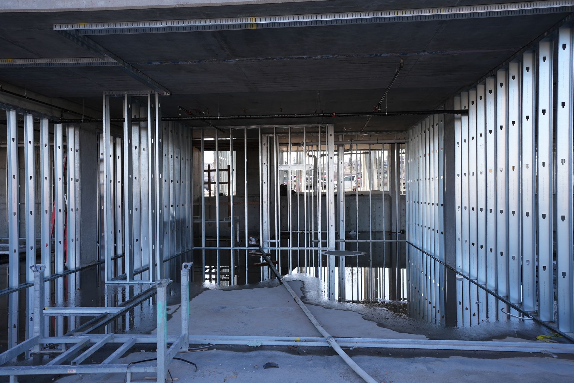 A building under construction with a lot of metal frames.