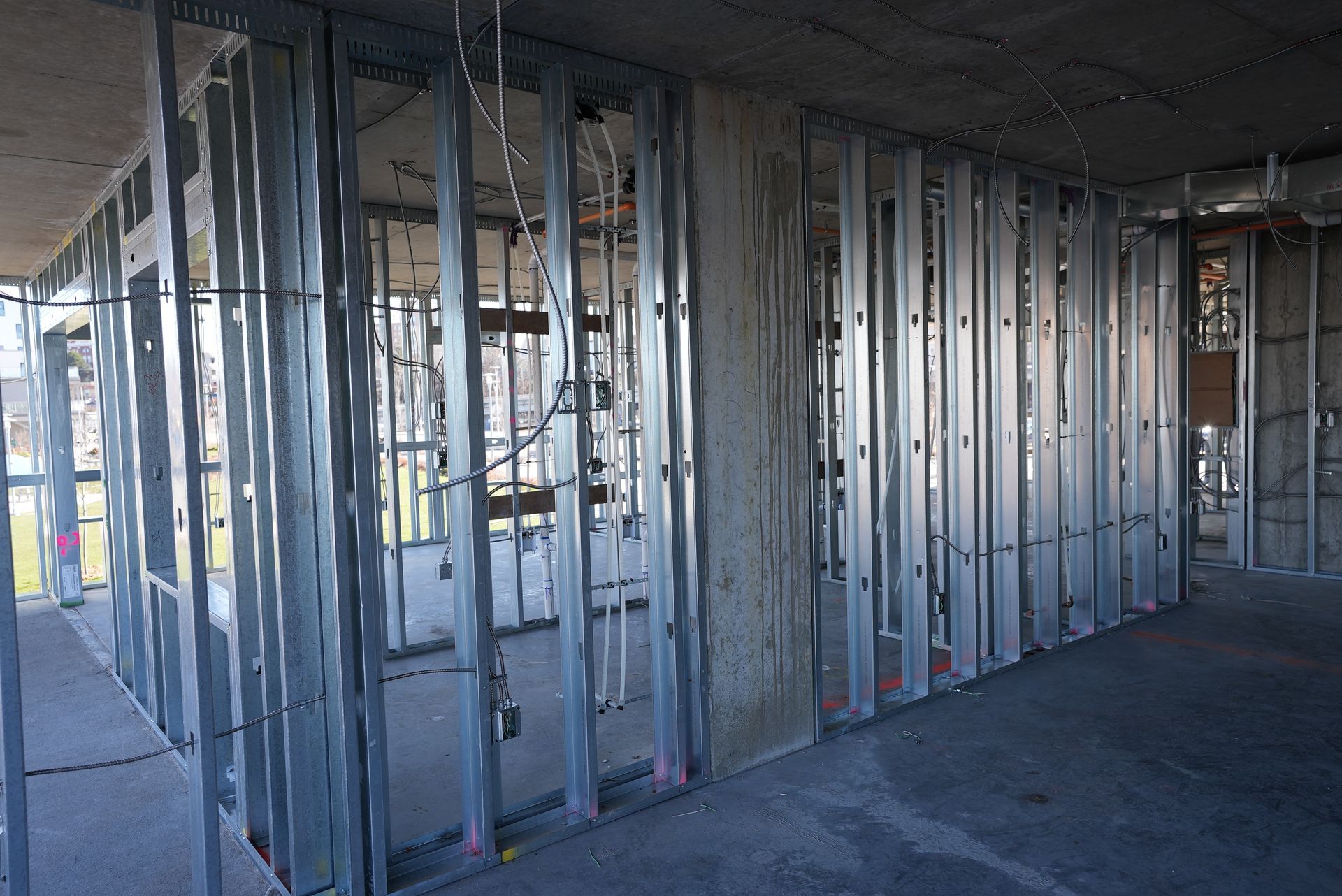 A building under construction with a lot of metal frames on the walls.