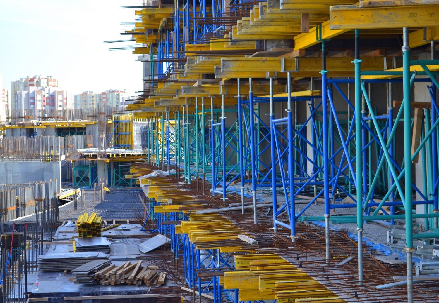 A construction site with a lot of scaffolding and a building under construction.