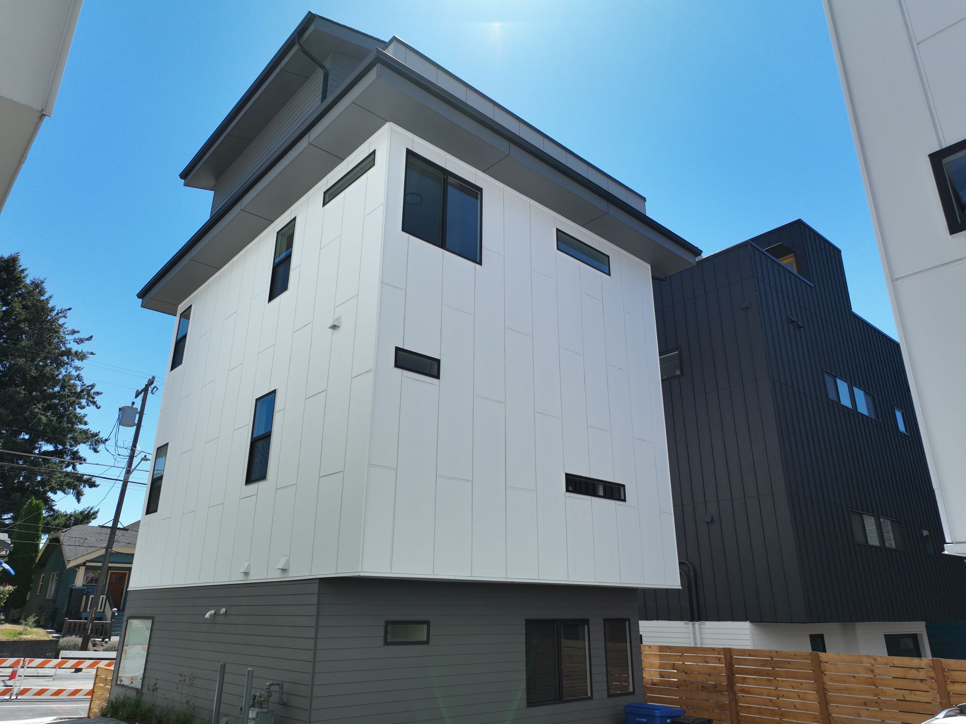A building with a lot of windows and a blue sky in the background