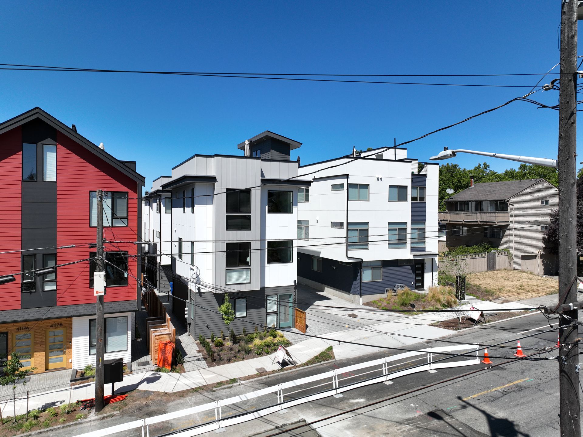 An aerial view of a row of buildings on a sunny day