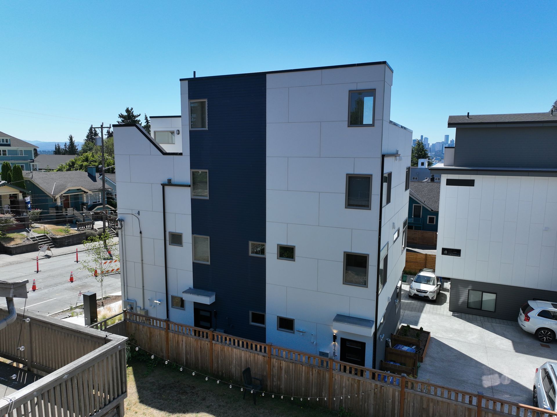 An aerial view of a building with a fence around it