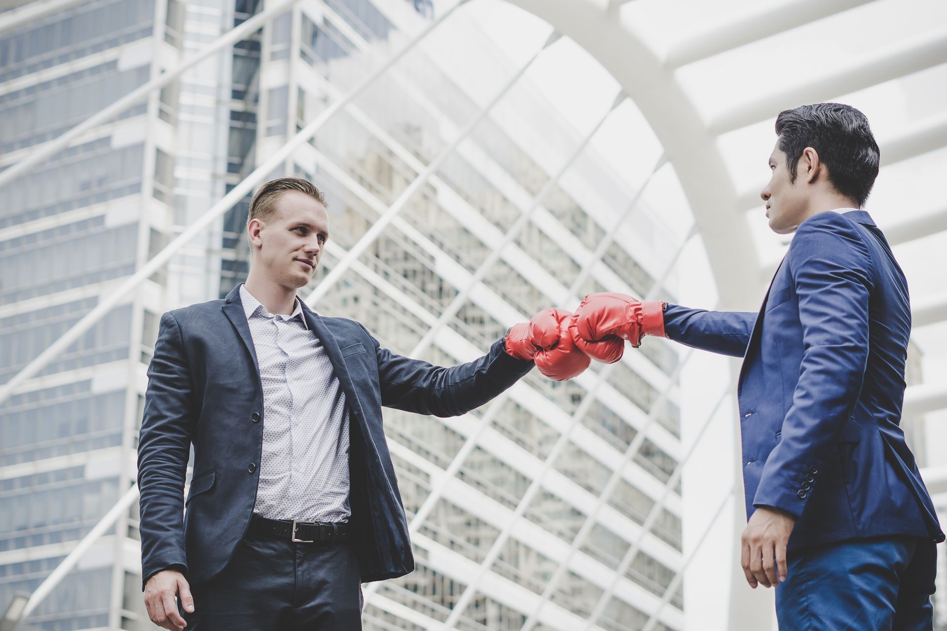 Two men touching gloves