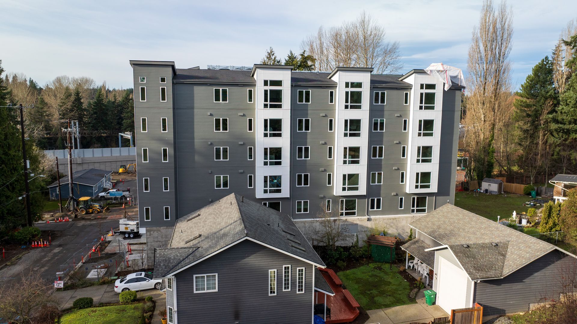 an aerial view of a large apartment building under construction An aerial view of a large apartment building under construction