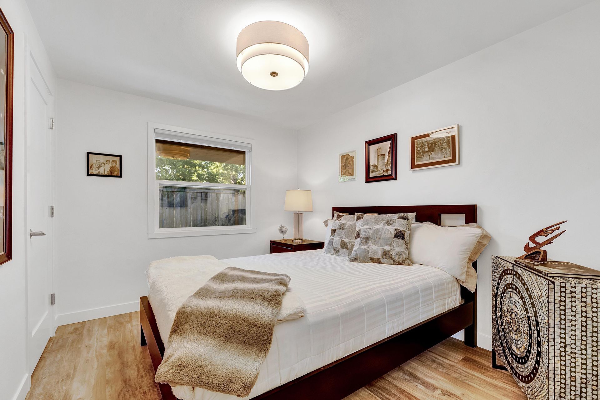 A bedroom with a large bed and a window