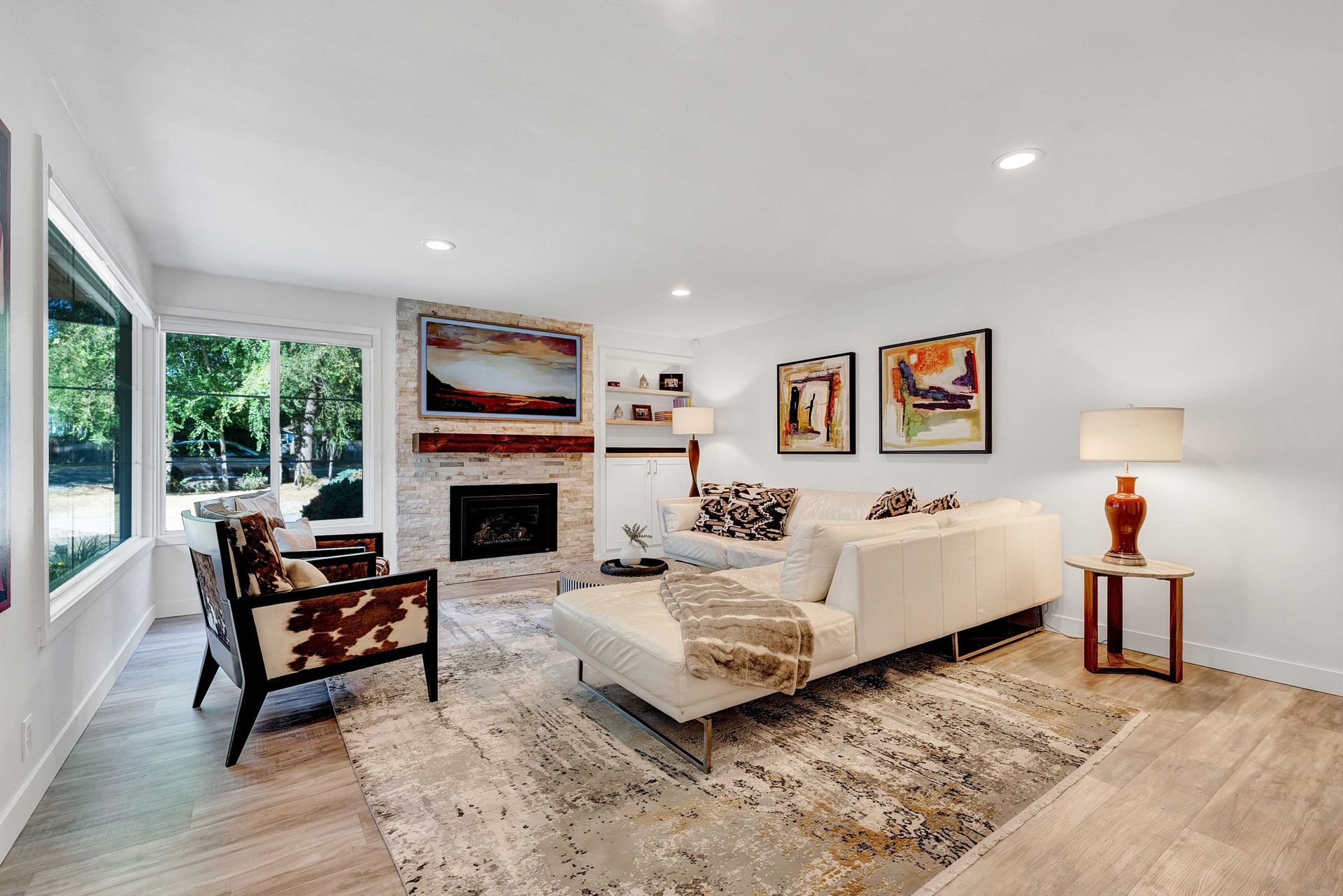 A living room filled with furniture and a fireplace.