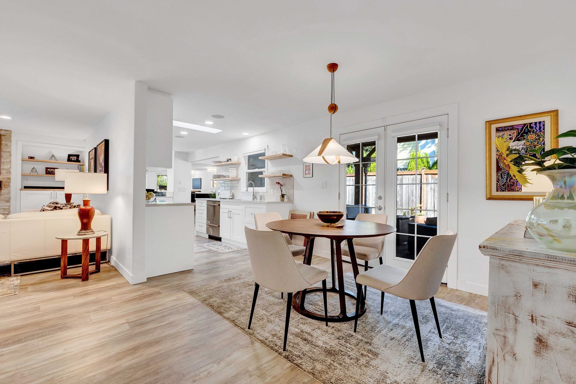 A dining room with a table and chairs in a house.