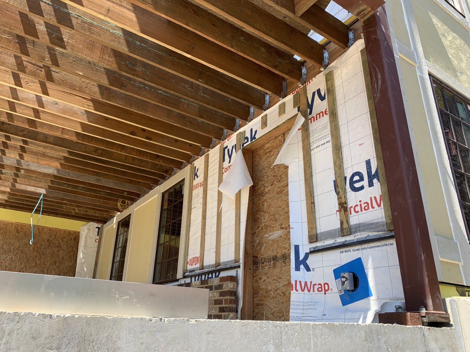 A building under construction with a lot of wooden beams.