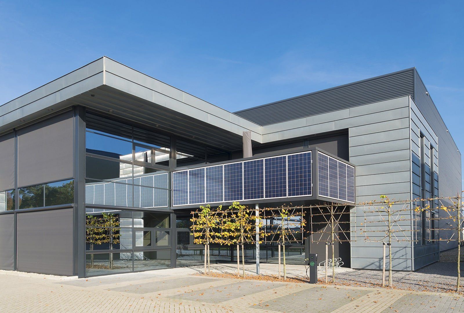 Modern look commercial establishment A large building with solar panels on the side of it