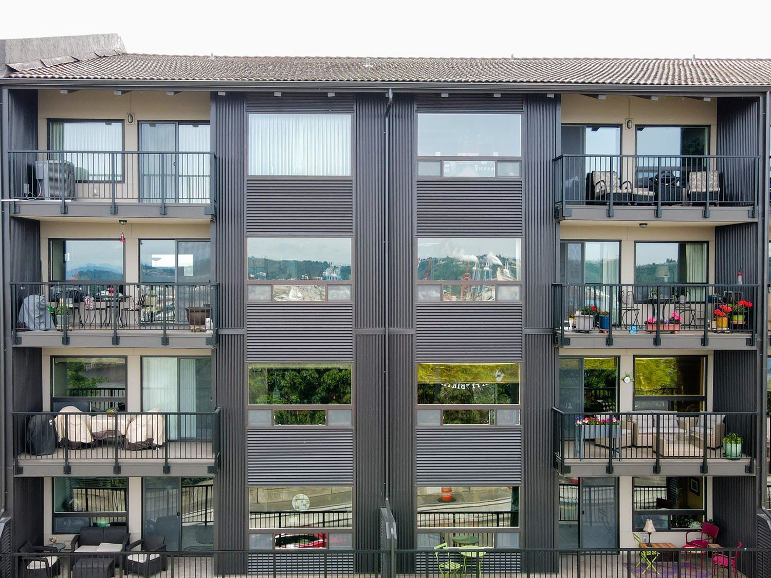 A large apartment building with a lot of windows and balconies.