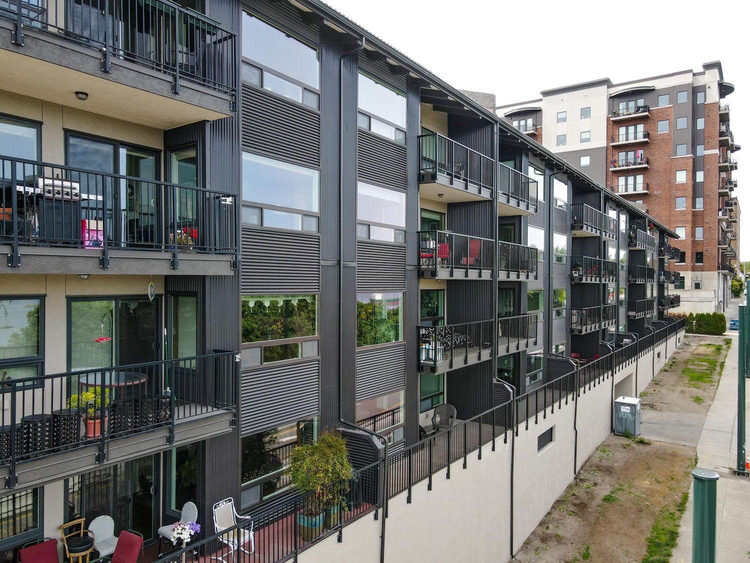 An aerial view of a row of apartment buildings with balconies.