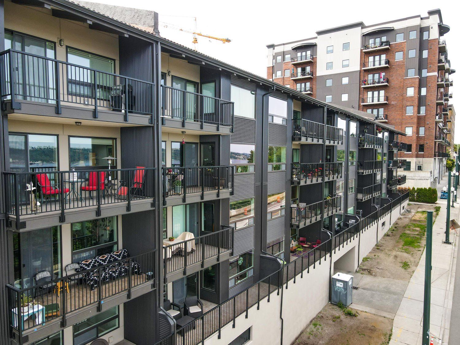 An aerial view of a large apartment building with balconies.