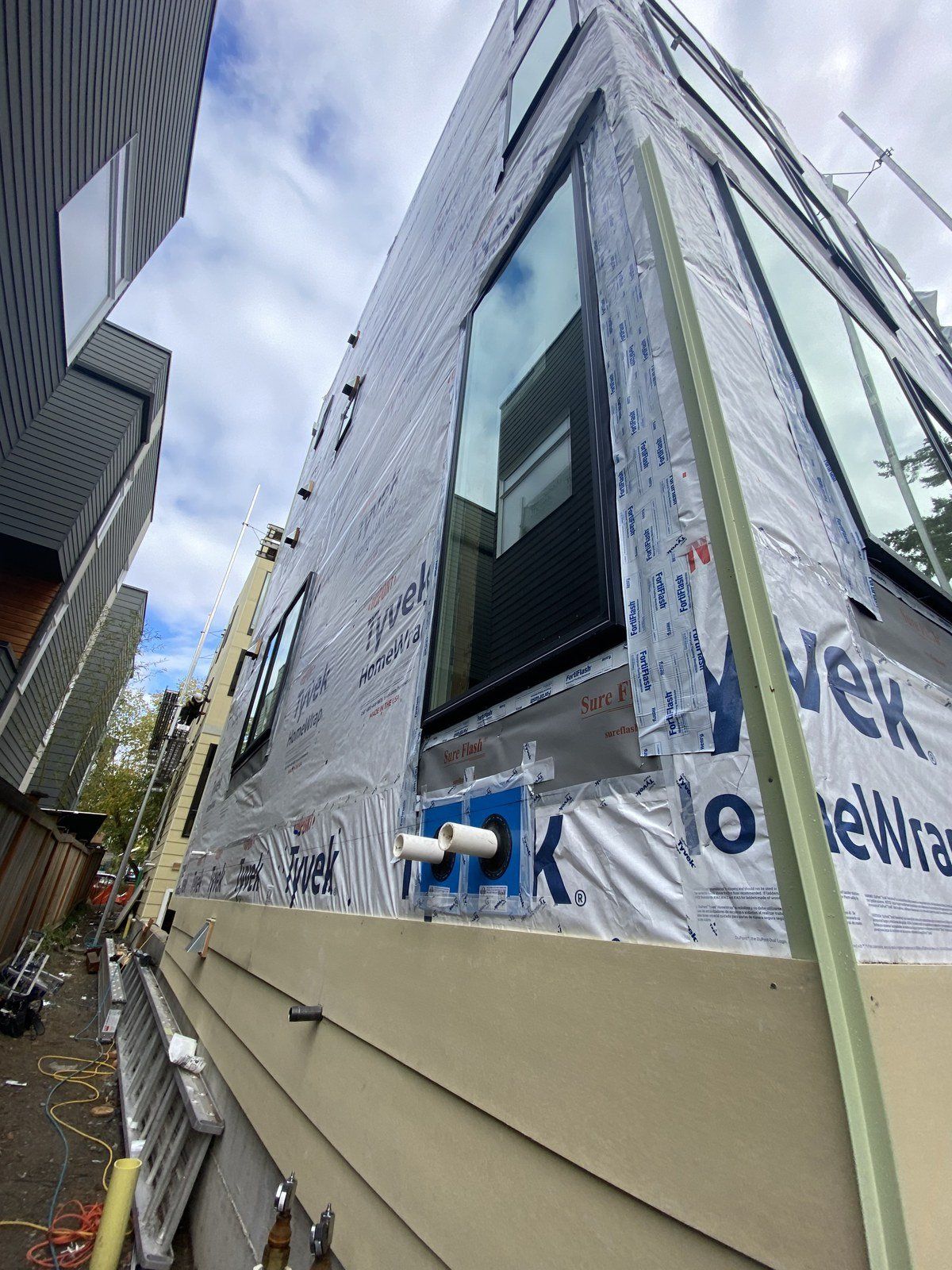 A building with a lot of windows is being built.