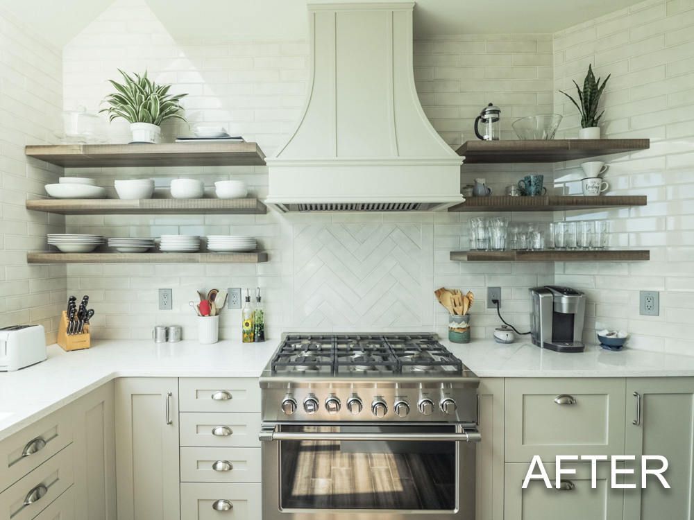 A kitchen with white cabinets and a stove top oven