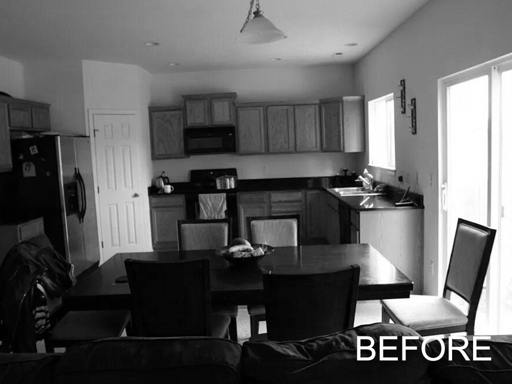 A black and white photo of a kitchen with the word before on the bottom
