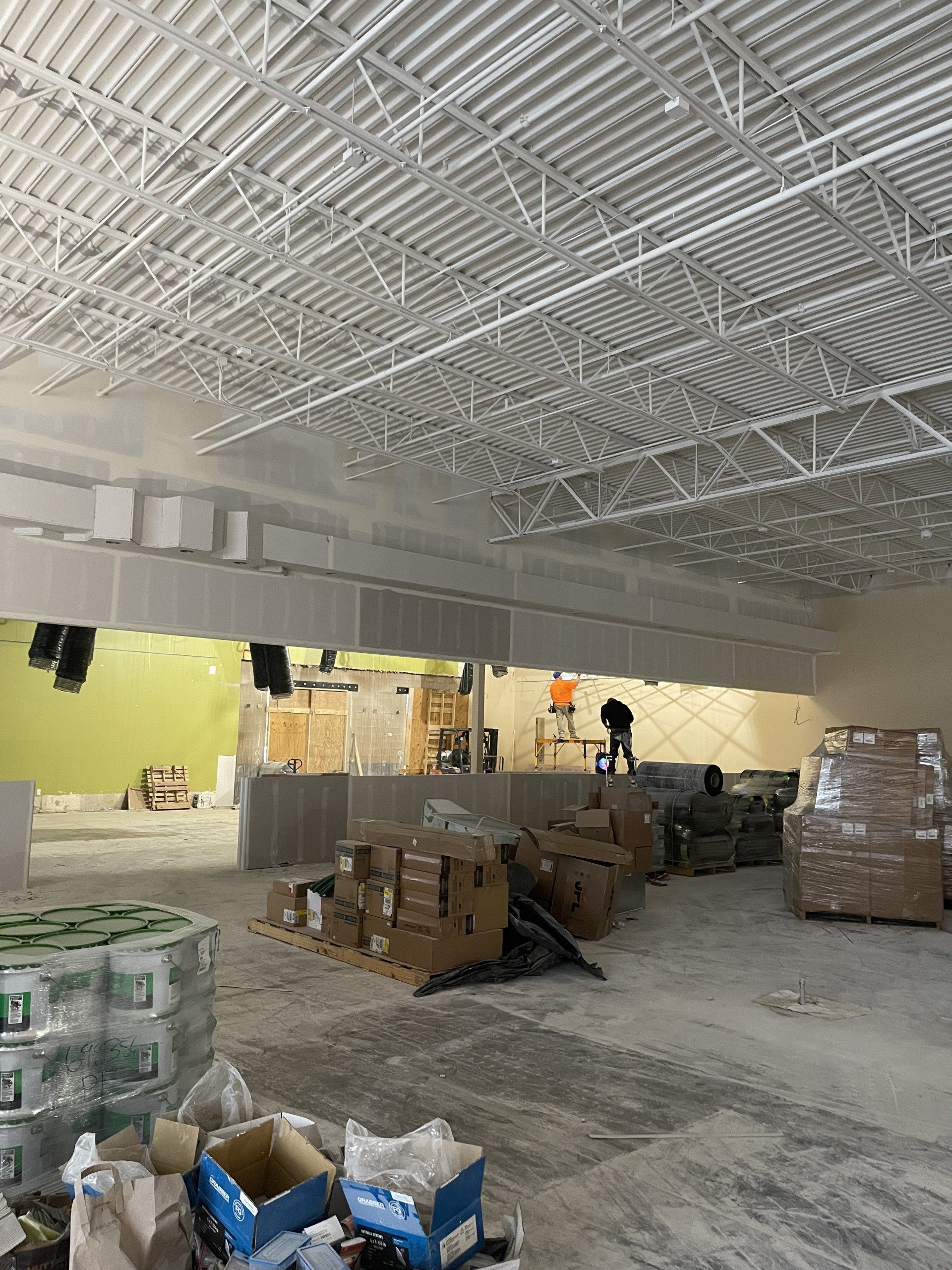 A large room with a lot of boxes and boxes on the floor.