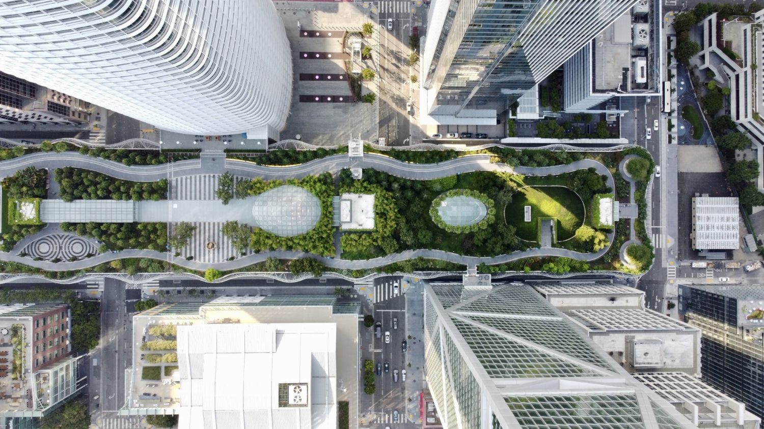 An aerial view of a city with lots of buildings and trees.
