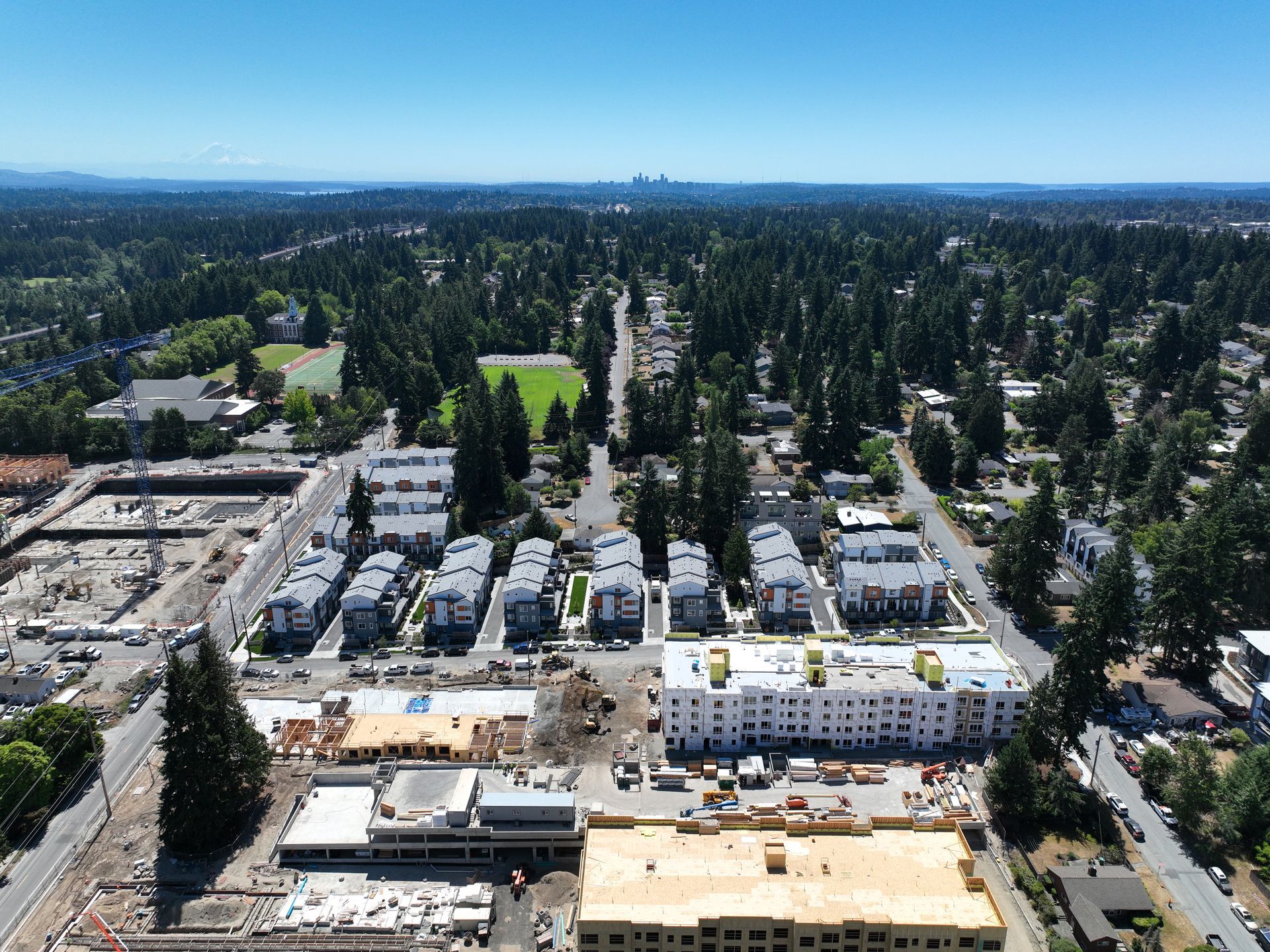 An aerial view of a city with lots of buildings and trees
