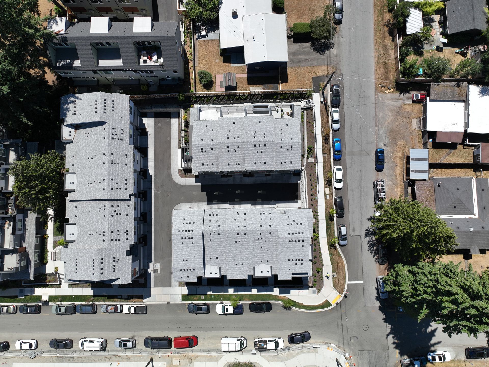 An aerial view of a residential area with a lot of buildings