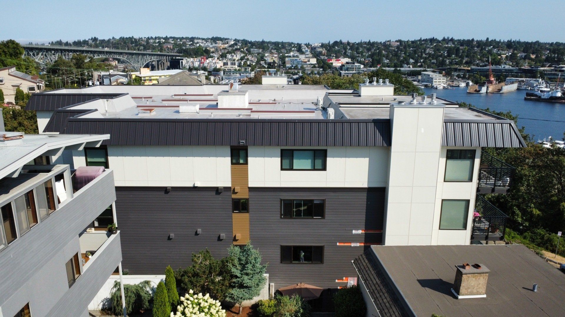 An aerial view of a building with a chimney on the roof