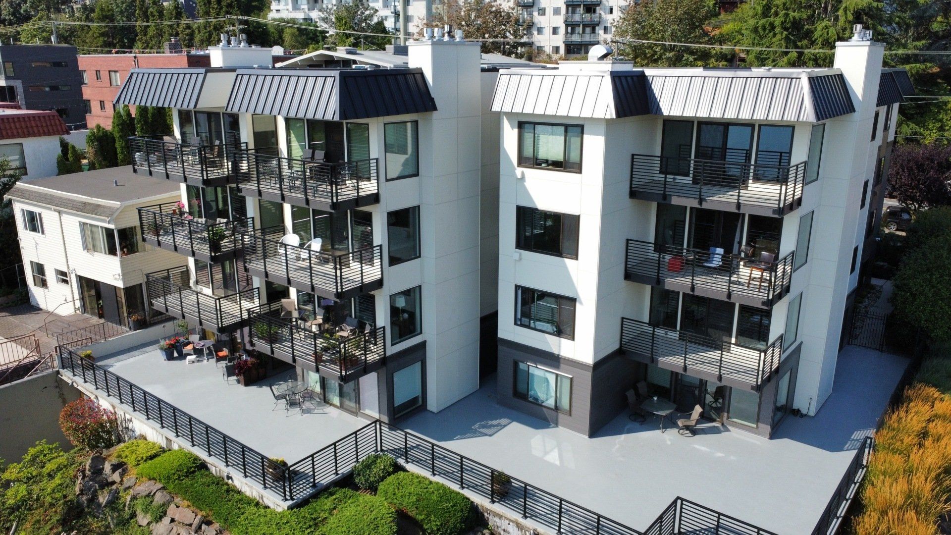 An aerial view of a large apartment building with balconies