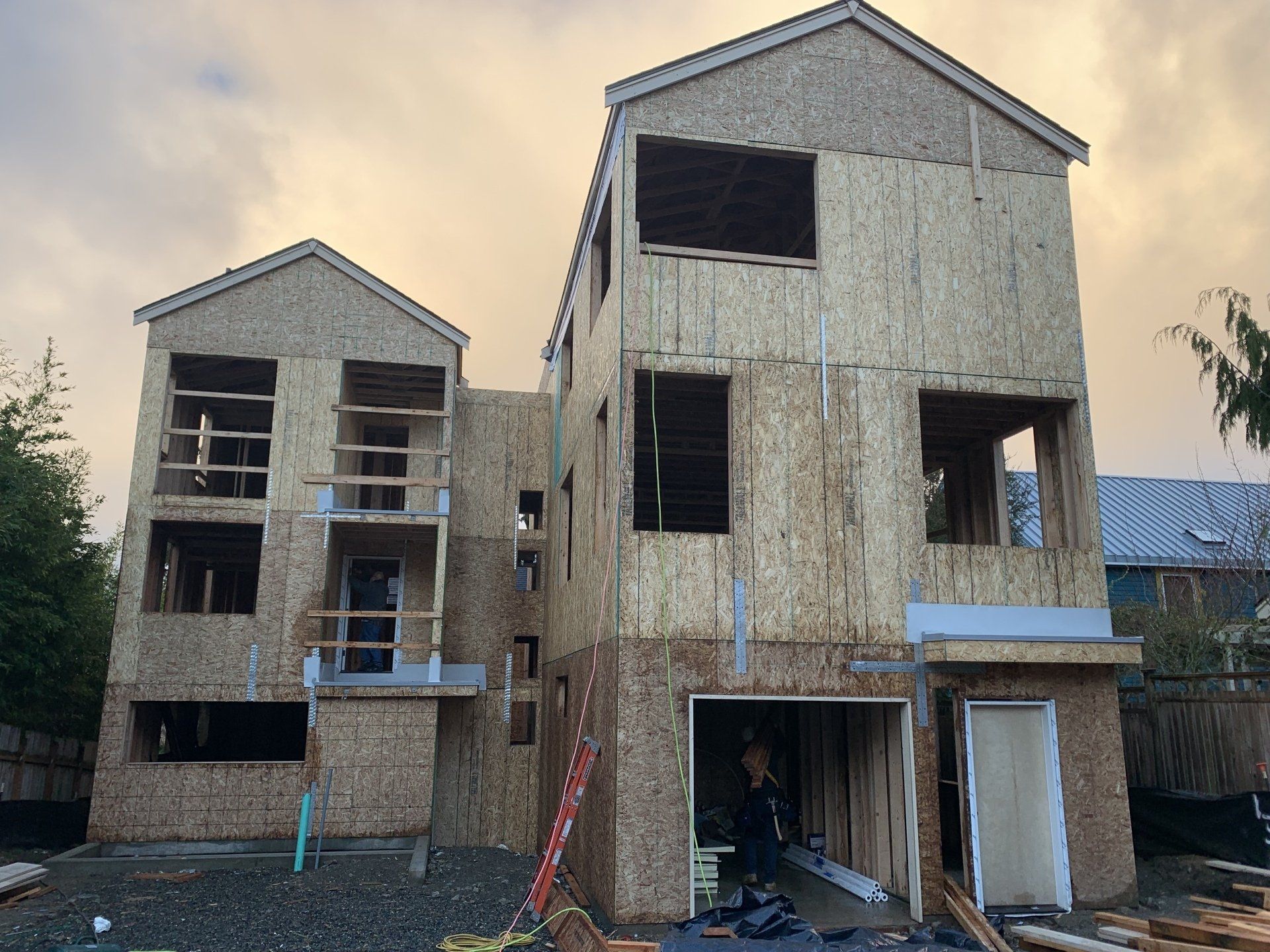 A house that is being built with a ladder in front of it