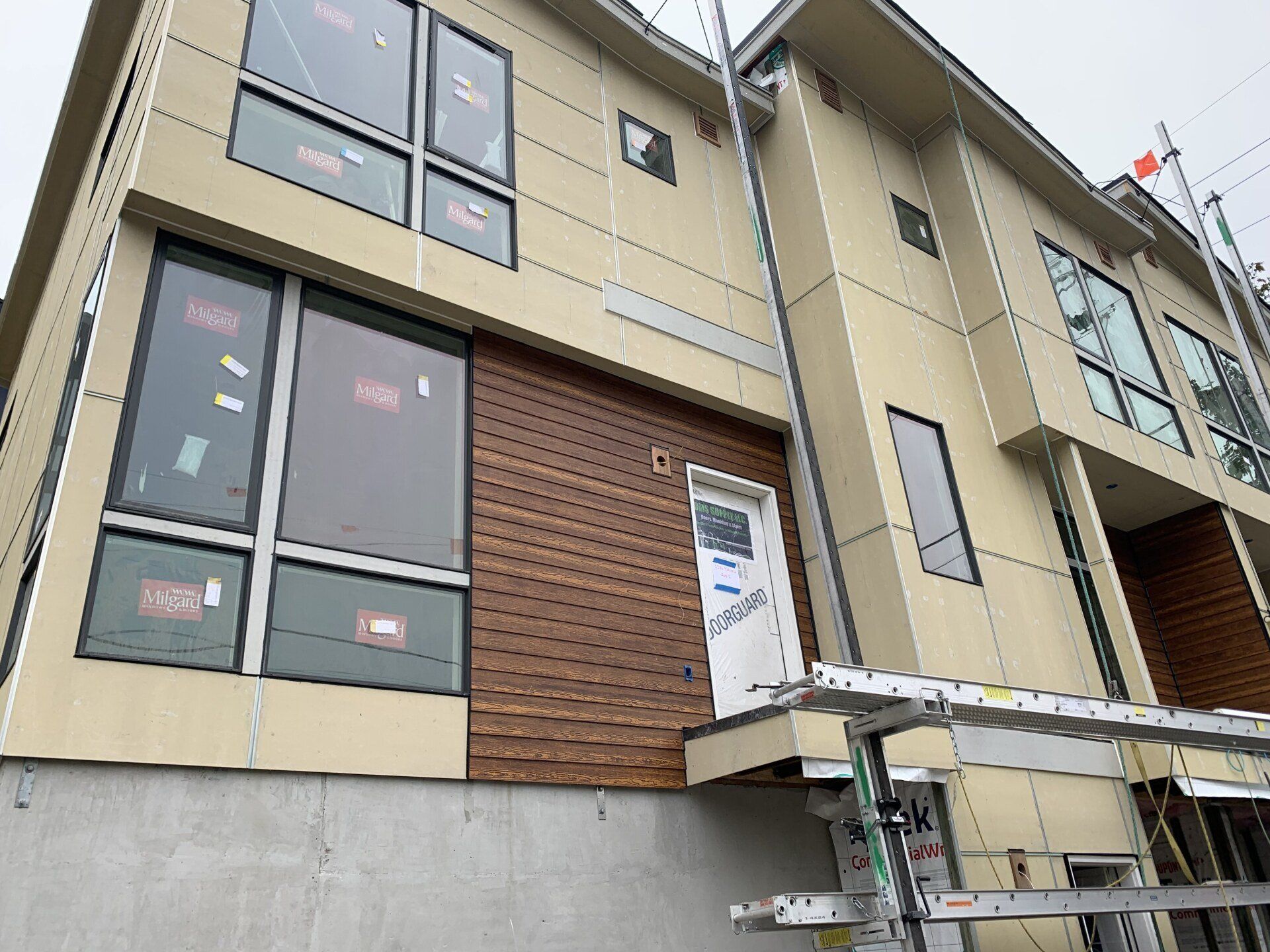 A large building with a lot of windows is being built.