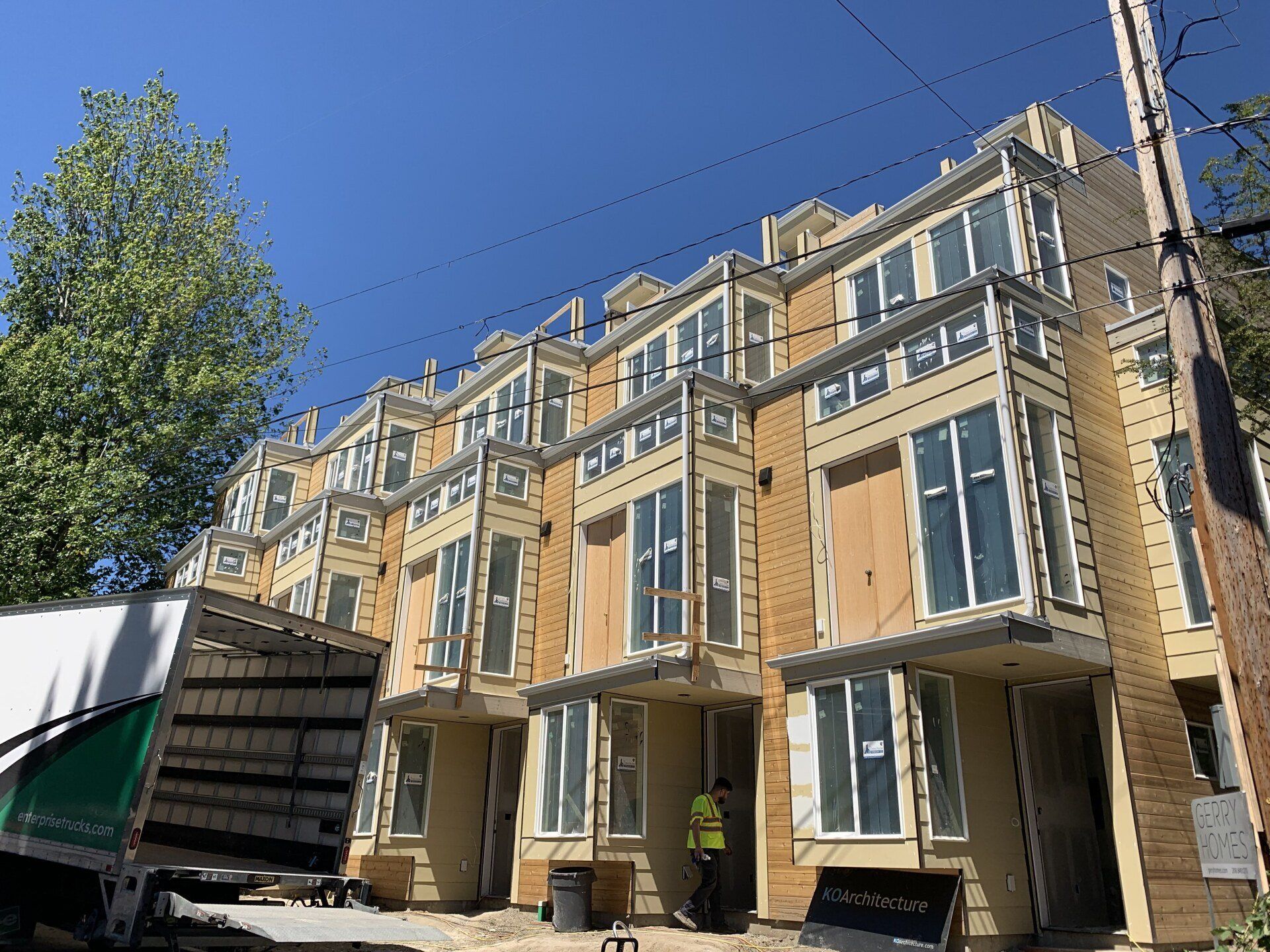 A building under construction with a truck parked in front of it.