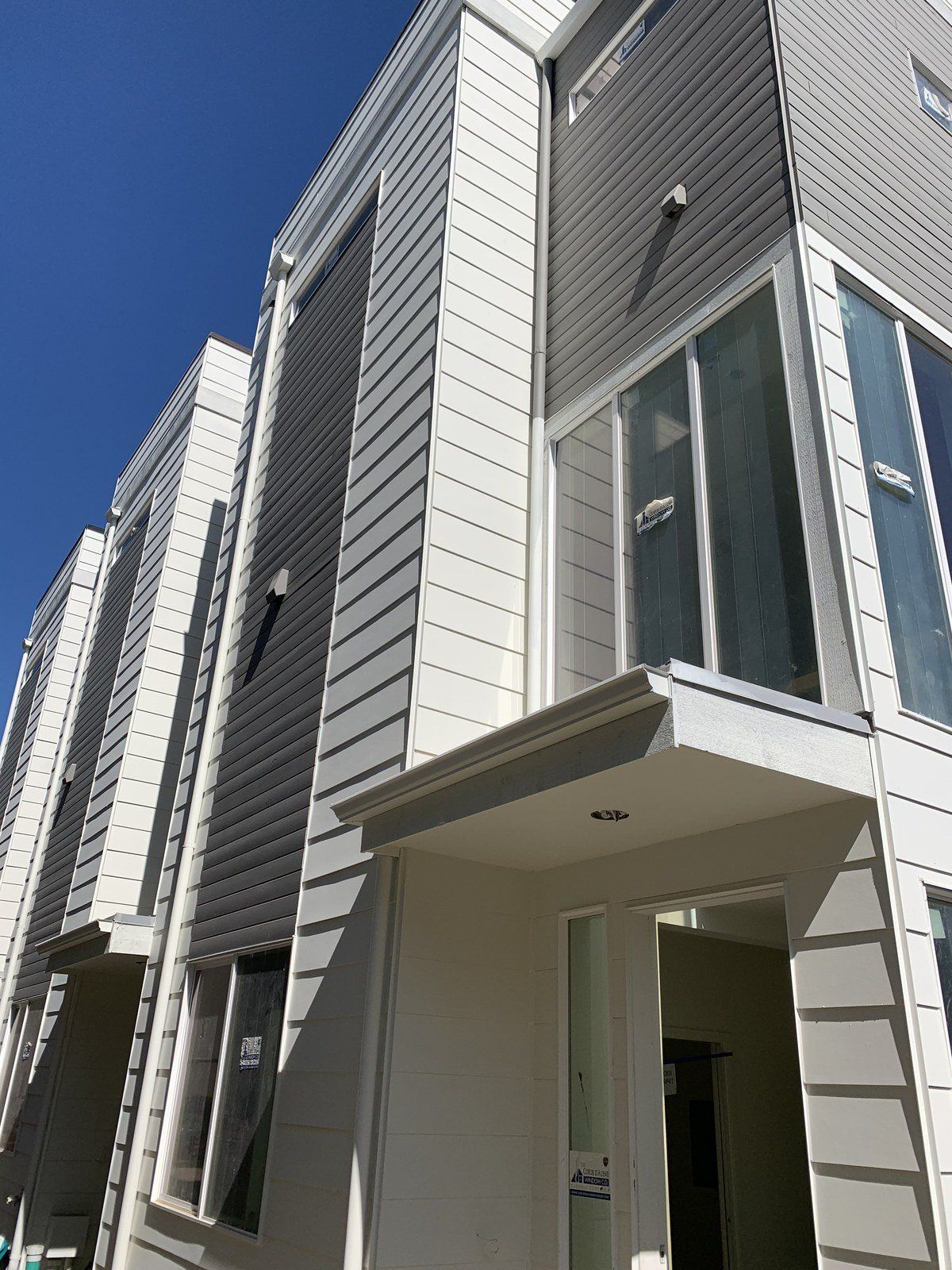 A building with a lot of windows and a blue sky in the background.