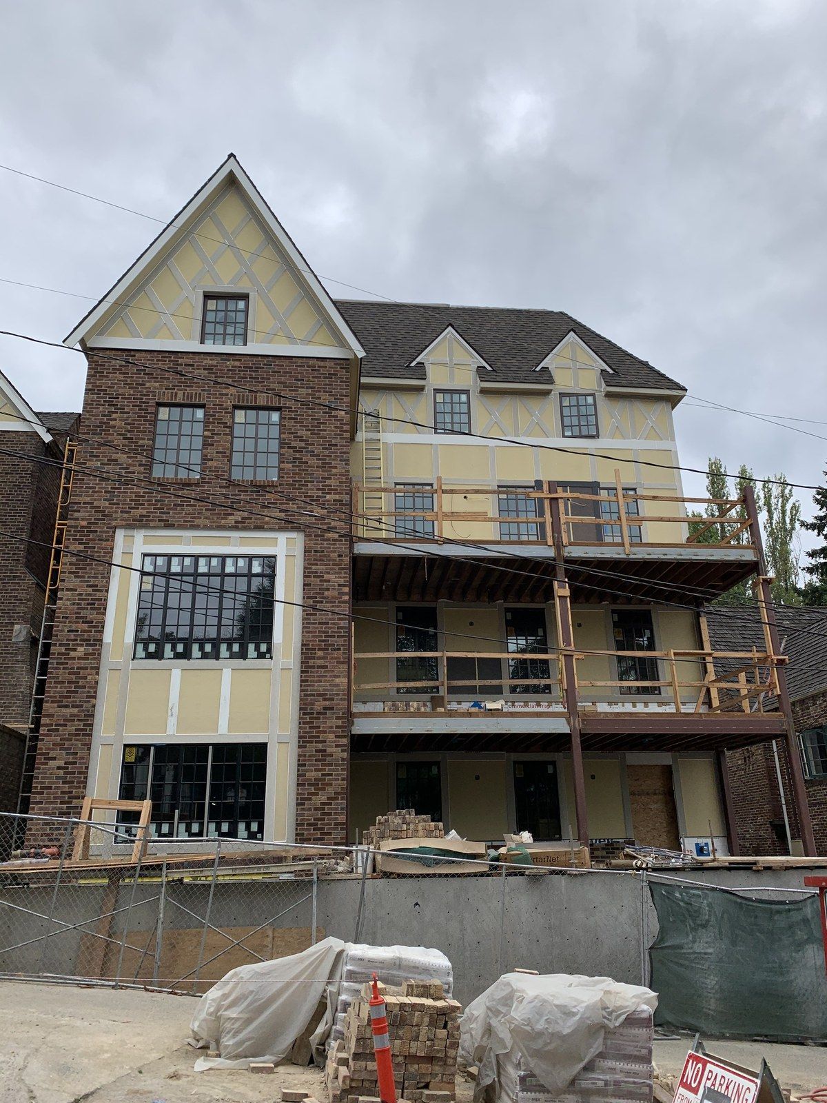 A large house is being built with a lot of windows.