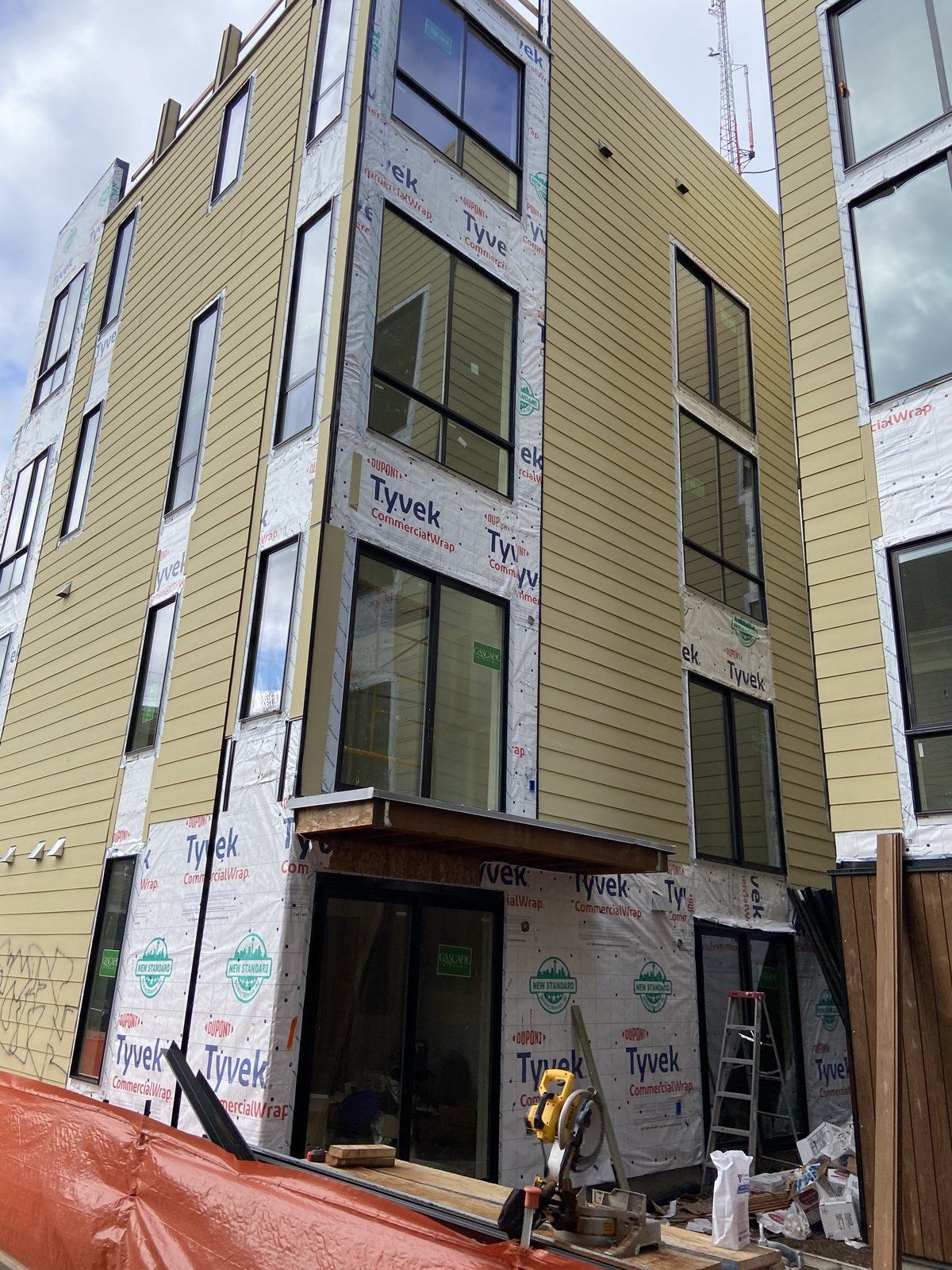 A large building with a lot of windows is being built.