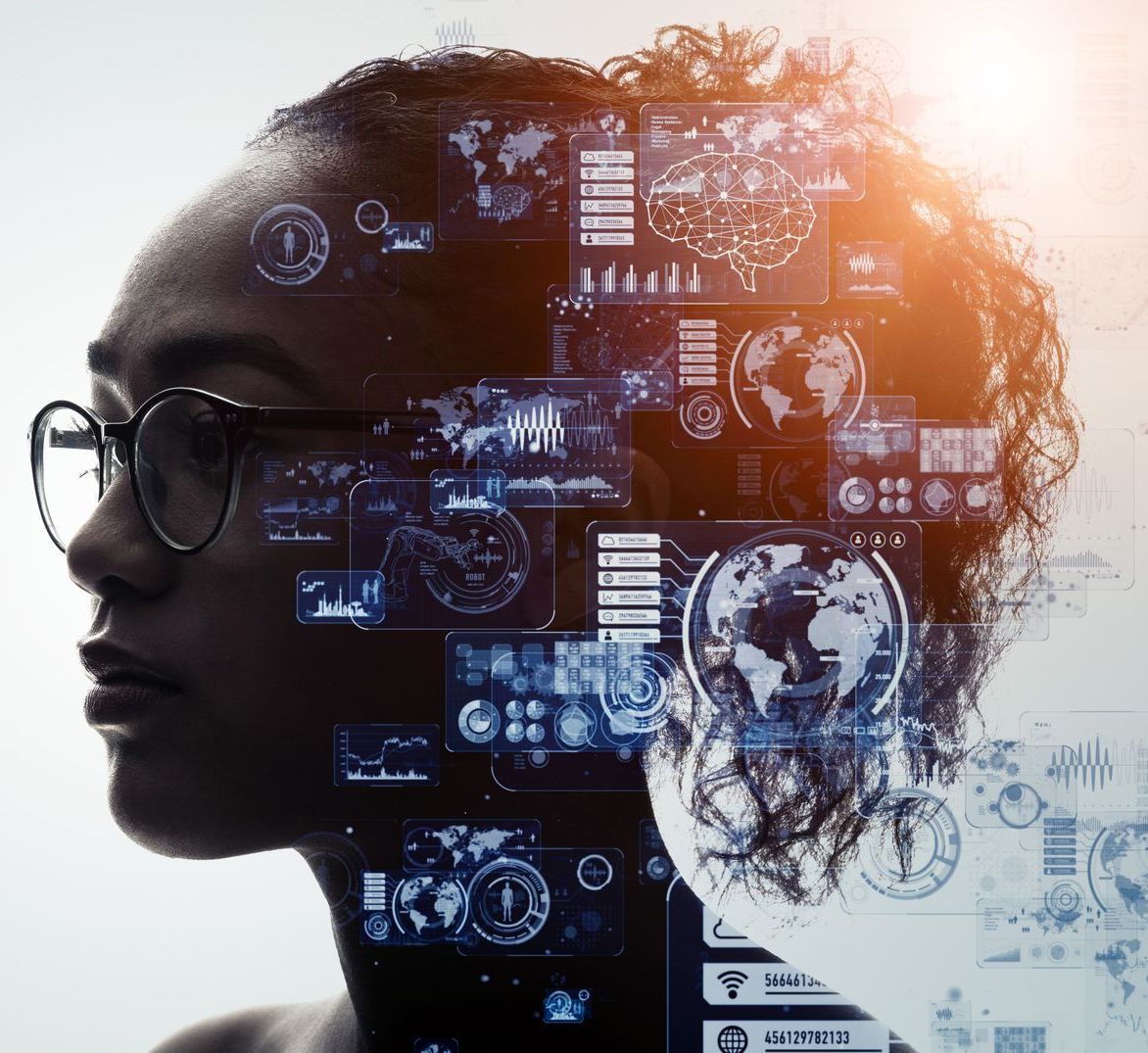 A double exposure of a woman wearing glasses and a computer screen.