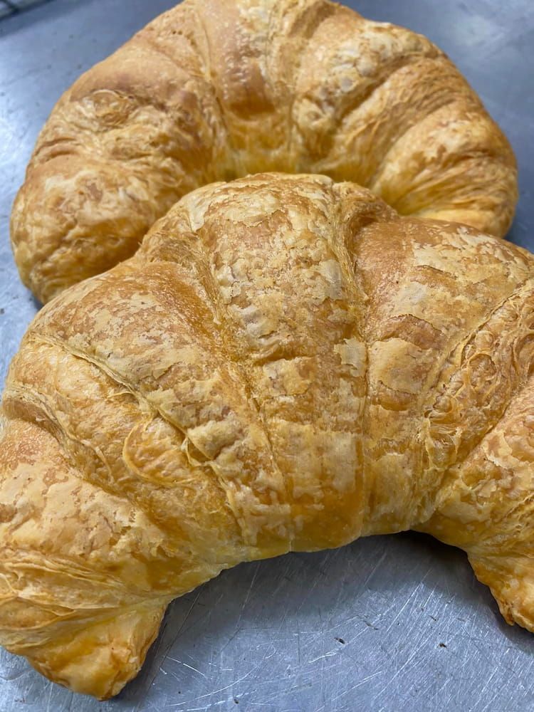 Two Croissants Are Sitting On Top Of Each Other On A Table β Cedar Park Bakehouse in Taranganba, QLD