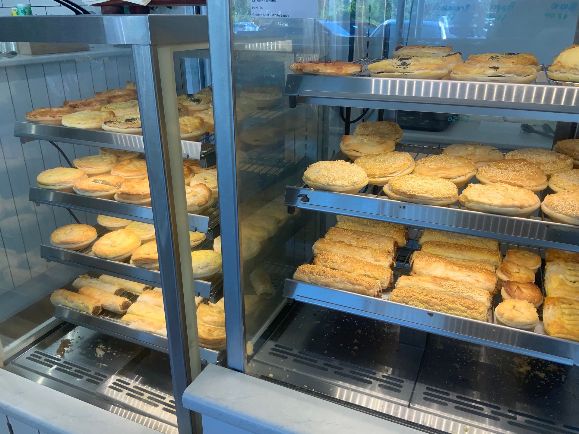Four Pies Are Sitting On A Tray On A Counter β Cedar Park Bakehouse in Taranganba, QLD