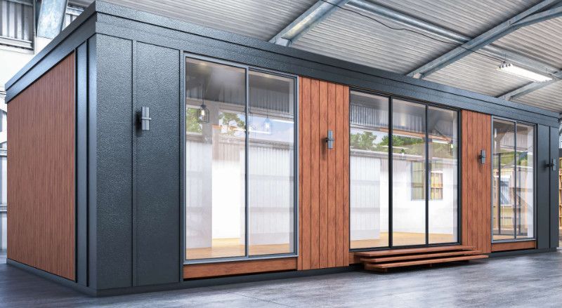 a large building with a lot of windows and doors in a warehouse .