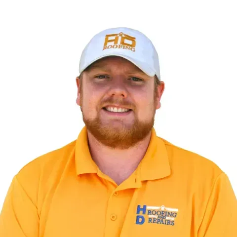 Man in orange shirt and white hat with 