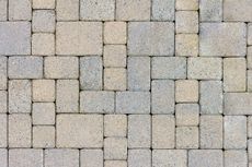 A close up of a brick walkway with a geometric pattern.