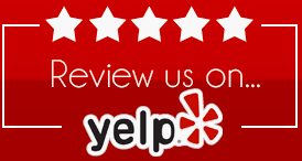 A red sign that says review us on yelp